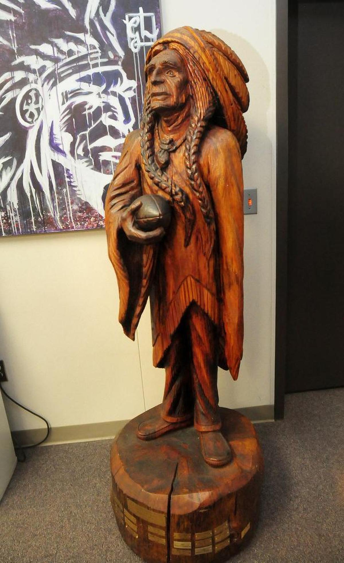 ELIAS FUNEZ/efunez@modbee.com - Westside rivals Orestimba and Gustine have a long shared tradition in which an alumni carved wooden statue dubbed ‘The Chief’ is traded between the two cities depending on the victor of their annual football matchup.