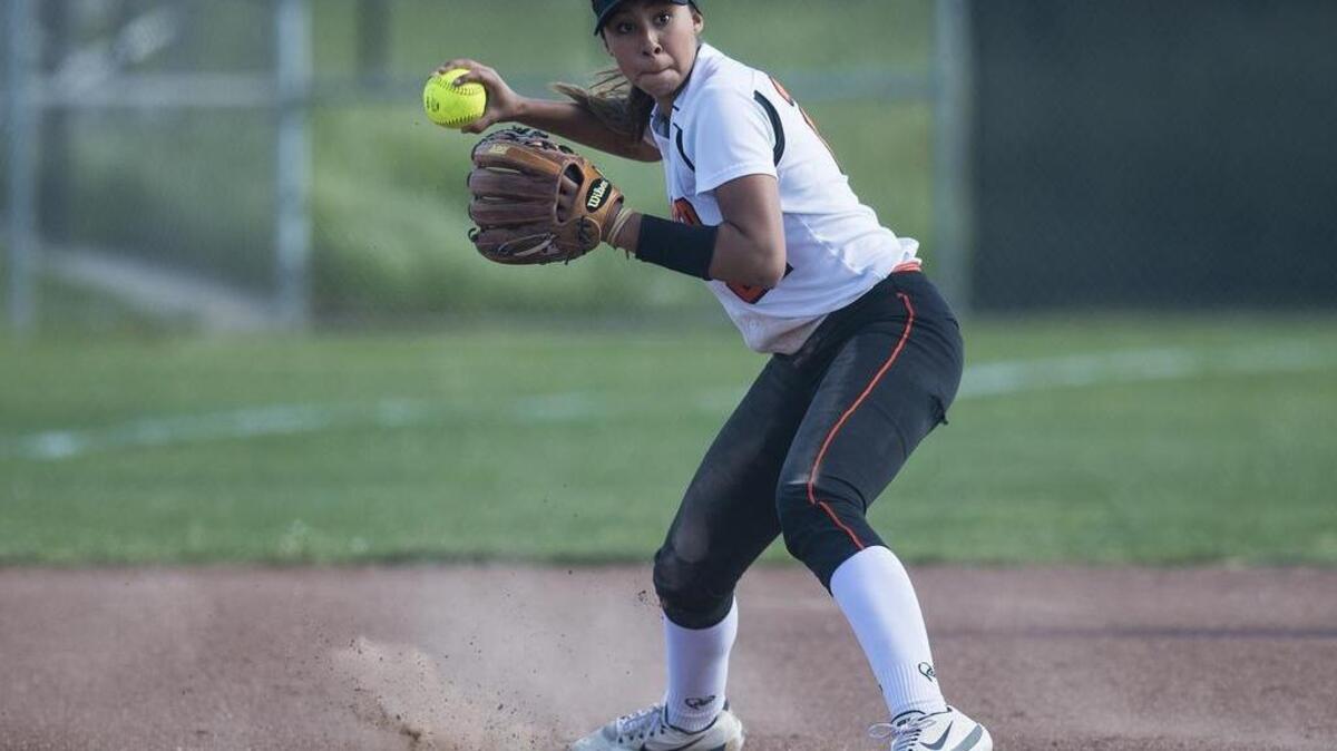 Merced sophomore Jewels Perez (21) throws to first base for an out during a game against El Capitan at El Capitan High School in Merced, Calif., on Thursday, April 19, 2018. The Bears beat the Gauchos 13-7.