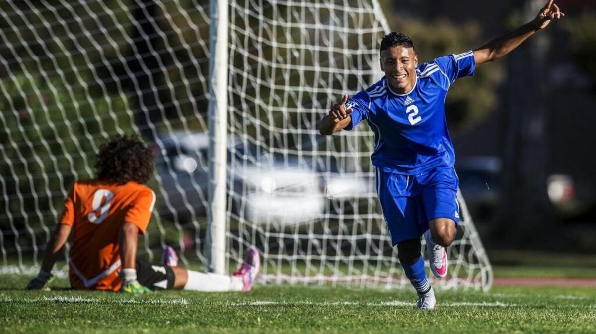 
Atwater senior Eduardo Cebrero (2) celebrates a goal during a game against Merced at Merced High School in Merced, Calif., Tuesday, Sept. 22, 2015. Cebrero finished the game with two goals as the Falcons beat the Bears 6-0.
